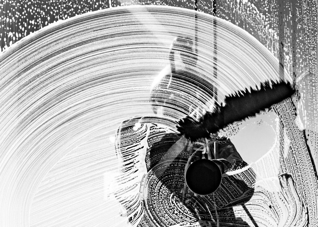 Artistic abstract image of a worker cleaning a window in Buenos Aires.